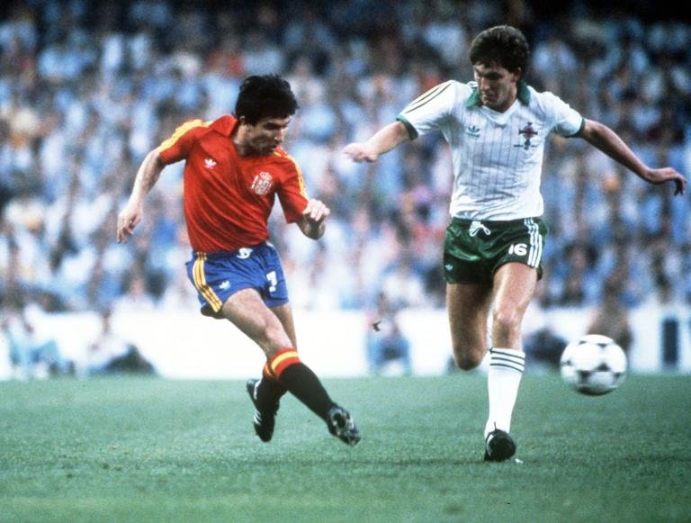 1982 World Cup Finals, Valencia, Spain, 25th June, 1982, Spain 0 v Northern Ireland 1, Spain's Juan Juanito beats Northern Ireland's Norman Whiteside (Photo by Bob Thomas Sports Photography via Getty Images)