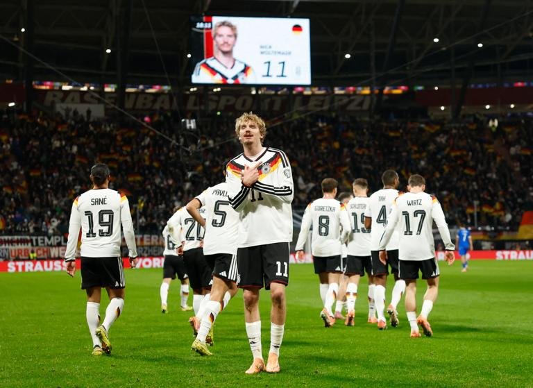 Germany's forward #11 Nick Woltemade celebrates scoring his team's first goal during the FIFA World Cup 2026 European qualification Group A football match between Germany and Slovakia, at the Red Bull Arena in Leipzig, eastern Germany on November 17, 2025. (Photo by Odd ANDERSEN / AFP) (Photo by ODD ANDERSEN/AFP via Getty Images)